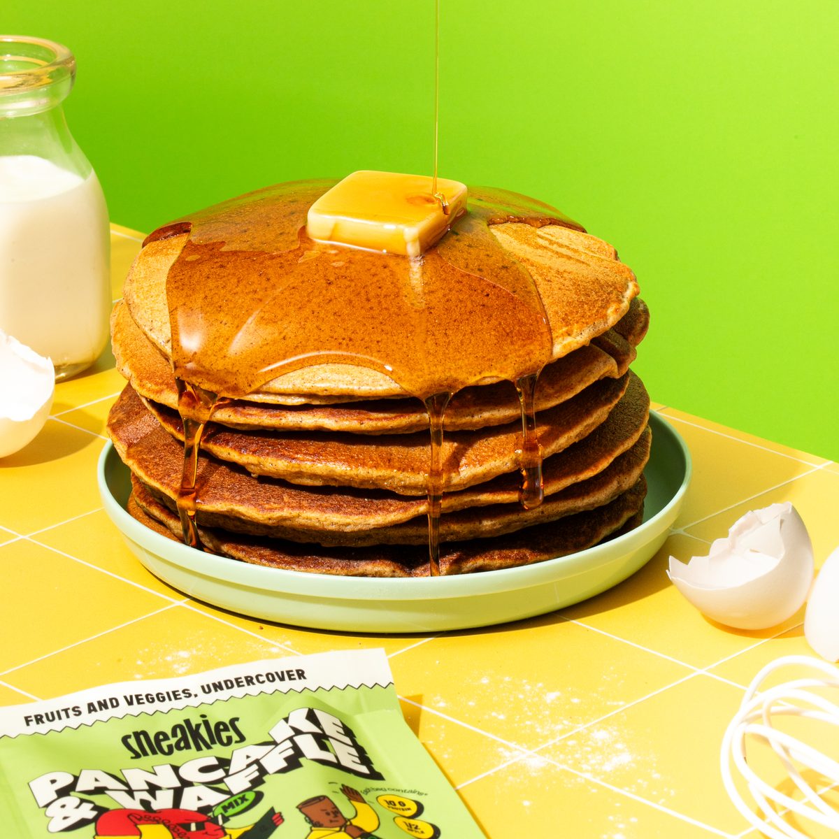 Apple Pie Agents pancake stack with the Sneakies package, spinach and an apple