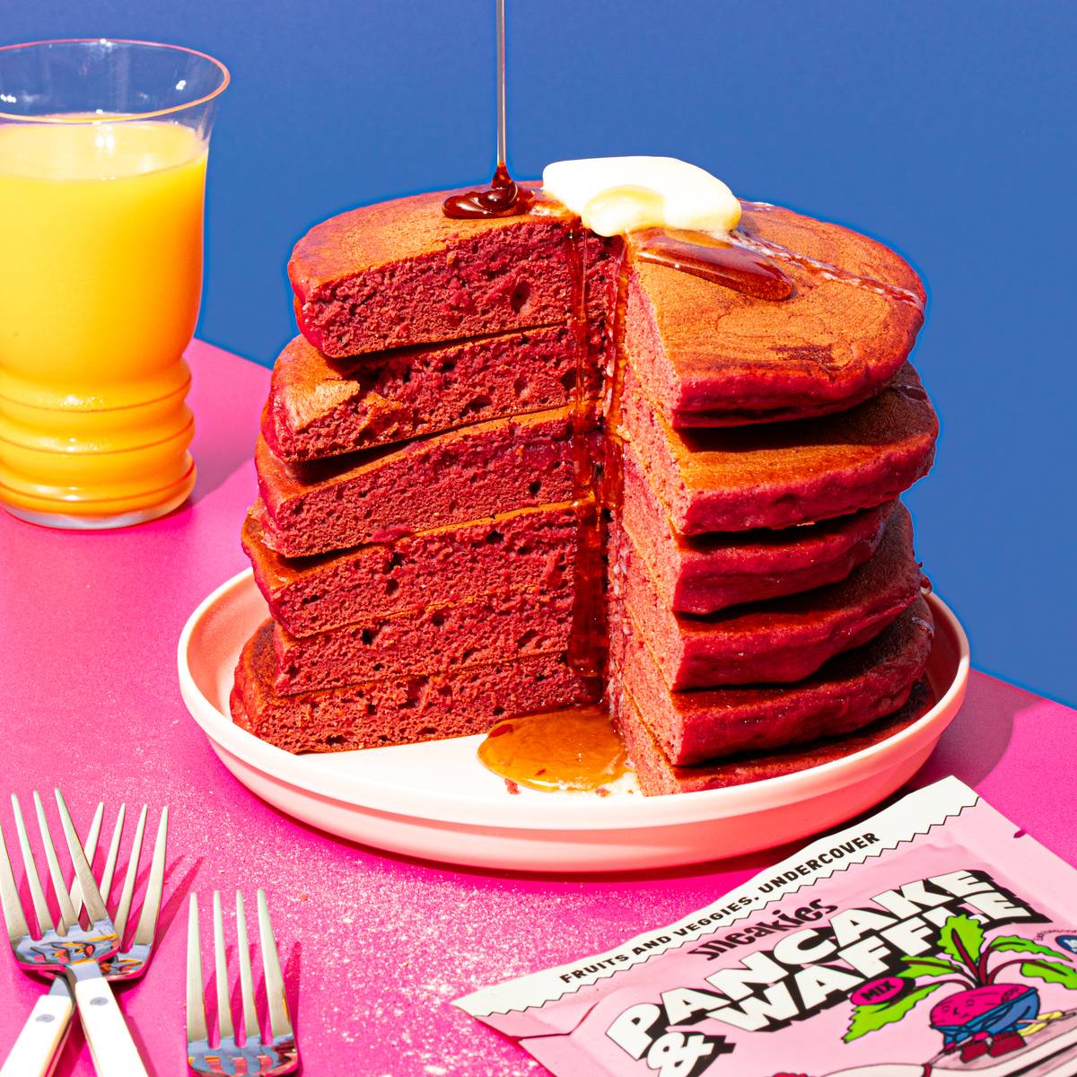 Berry Bandits pancake stack with the Sneakies package, strawberries, raspberries and a beet